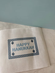 Happy Hanukkah blue and navy checkered printed needlepoint canvas with untaped edges