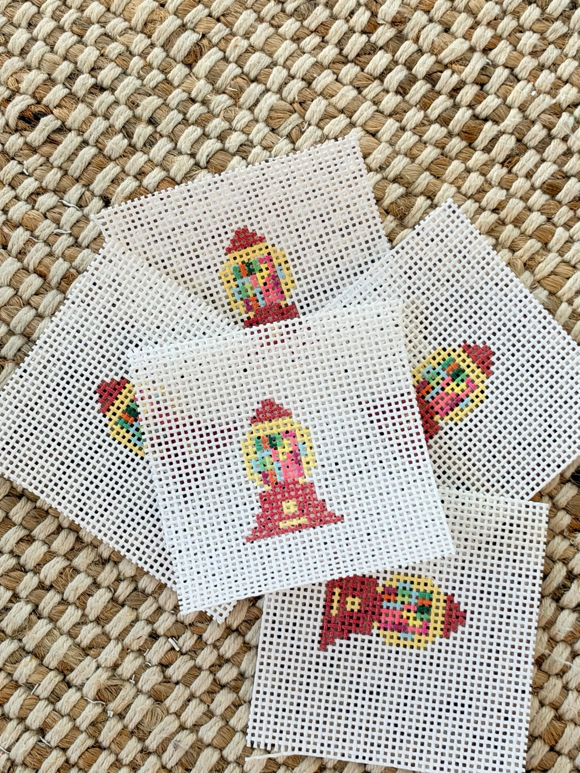 Several gumball machine mini needlepoint canvases shown together; sold individually