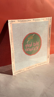 Tini Bit Merry green and pink printed needlepoint ornament canvas with branded taped edges